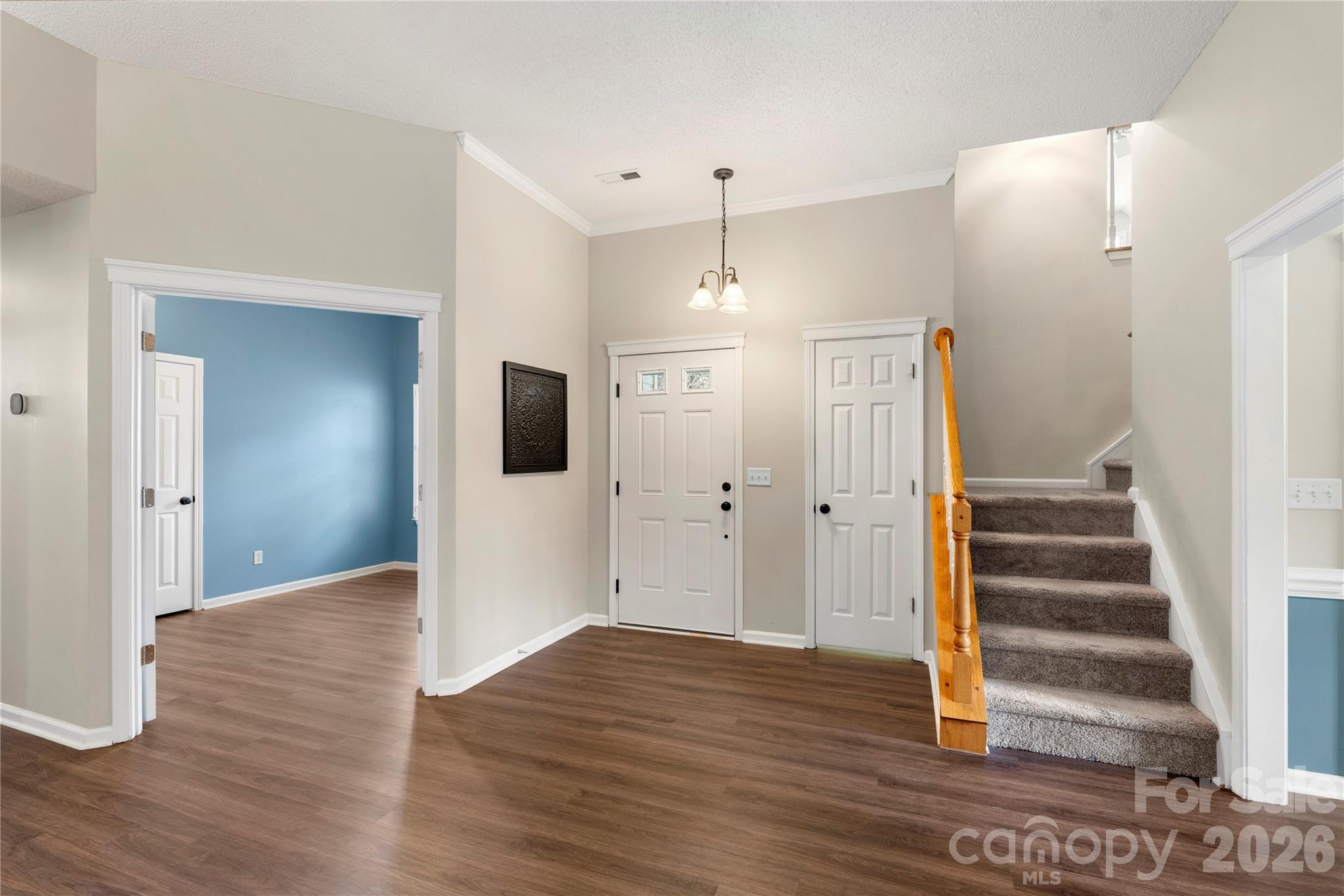 12028 Regent Ridge Lane Charlotte, NC 28278 - Photo 5 of 42 a view of a hallway with wooden floor and entryway