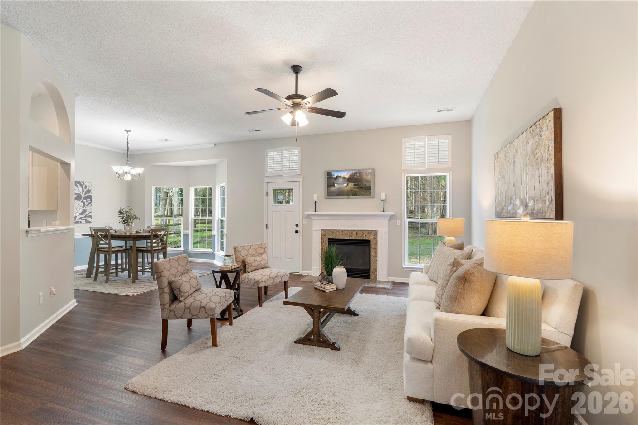 12028 Regent Ridge Lane Charlotte, NC 28278 - Photo 6 of 42 a living room with furniture a fireplace and a table