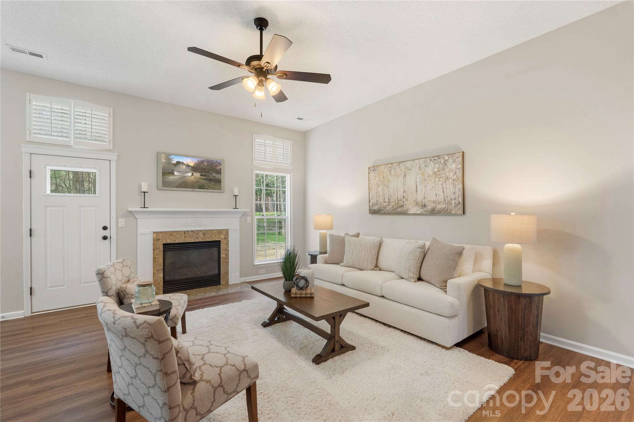12028 Regent Ridge Lane Charlotte, NC 28278 - Photo 7 of 42 a living room with furniture and a fireplace