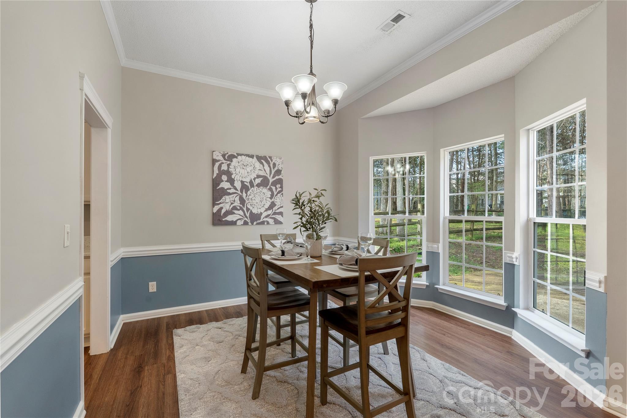 12028 Regent Ridge Lane Charlotte, NC 28278 - Photo 10 of 42 a view of a dining room with furniture window and wooden floor