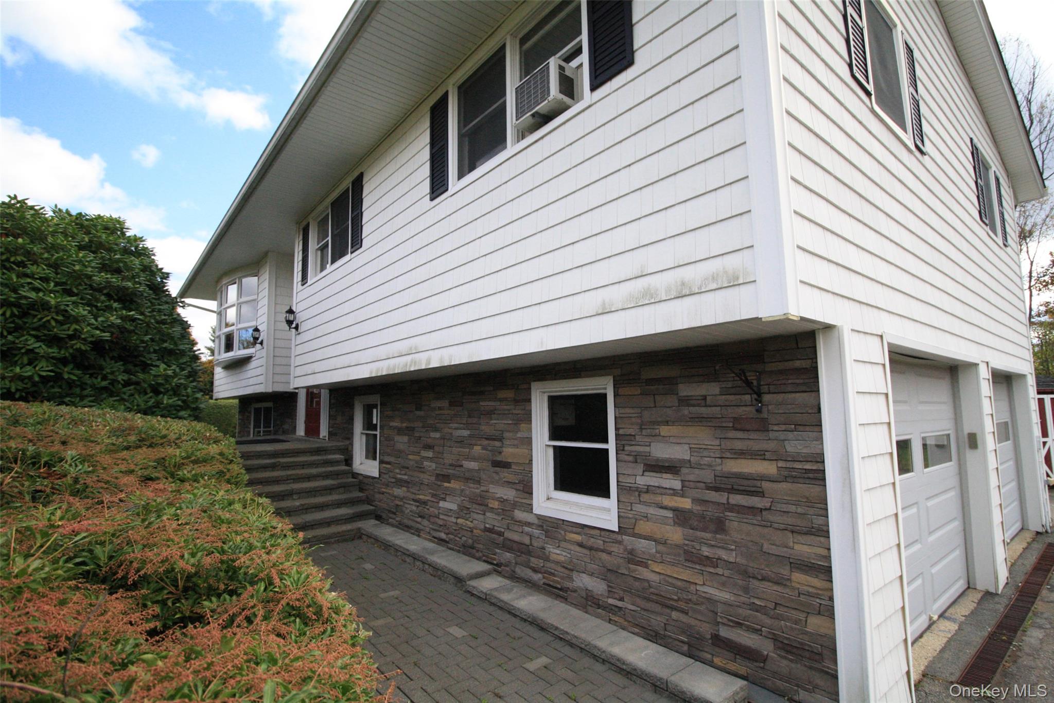 a front view of a house with windows
