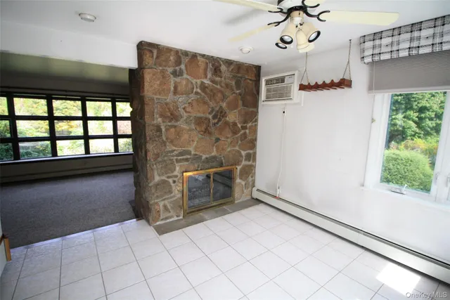 a view of an empty room and a window