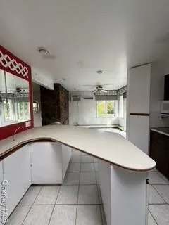 a kitchen with stainless steel appliances a sink and a refrigerator
