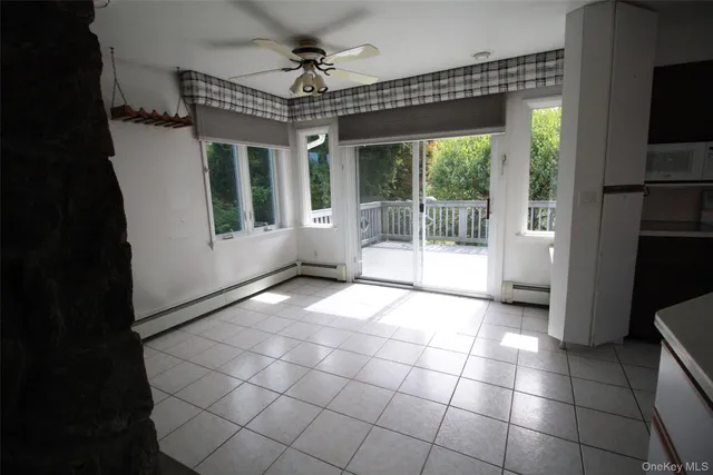 a view of entryway with a floor to ceiling window and a livingroom