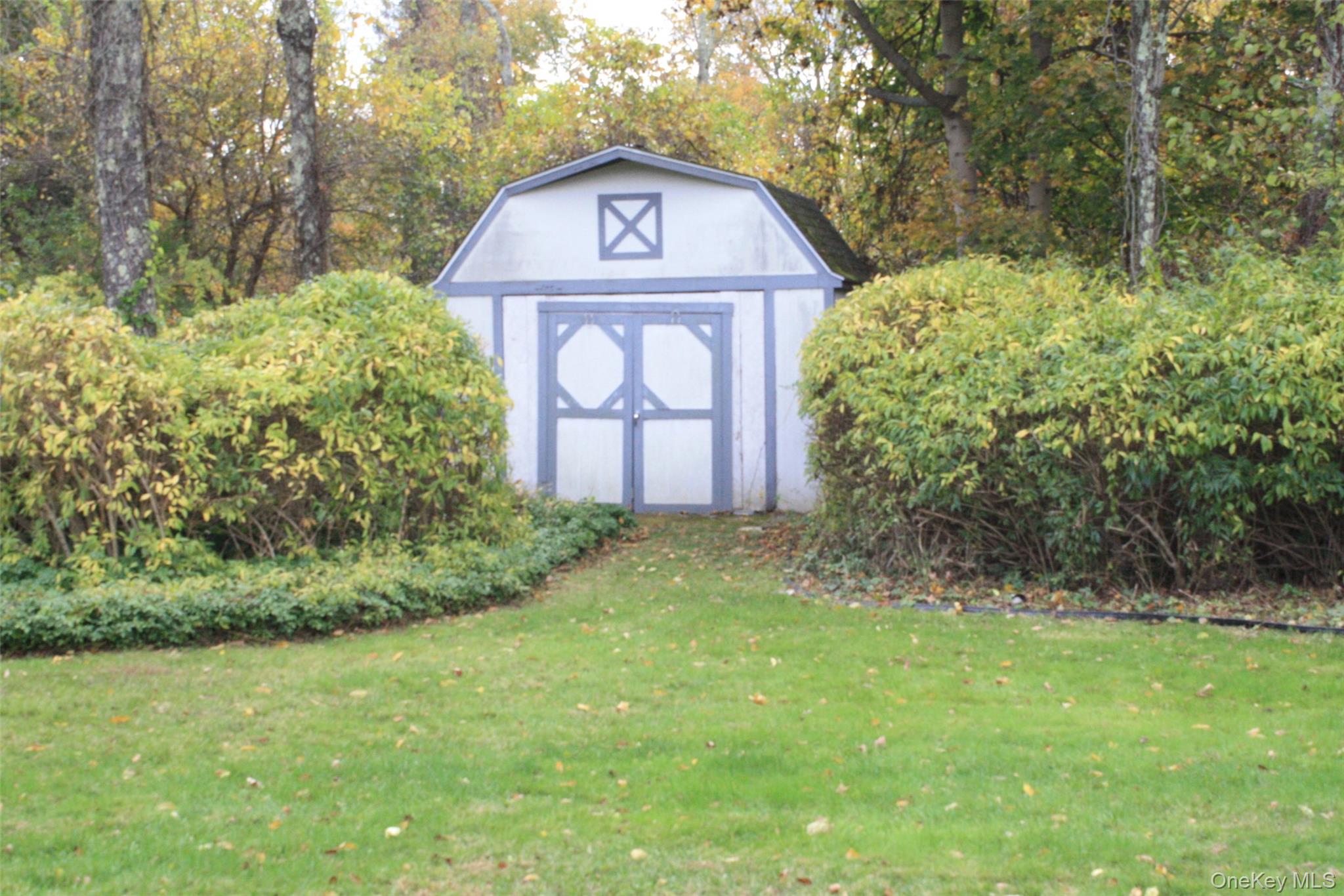 395 Mooney Hill Road Patterson, NY 12563 - Photo 24 of 26 a front view of a house with a yard