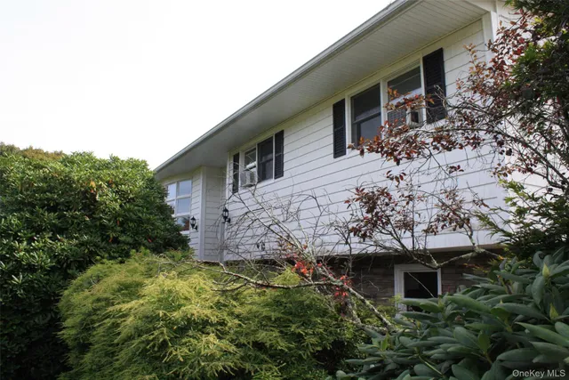 a view of a house with a tree