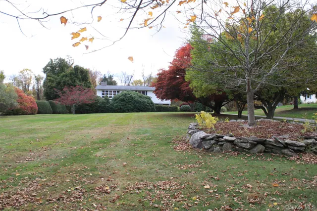 a backyard of a house with lots of green space