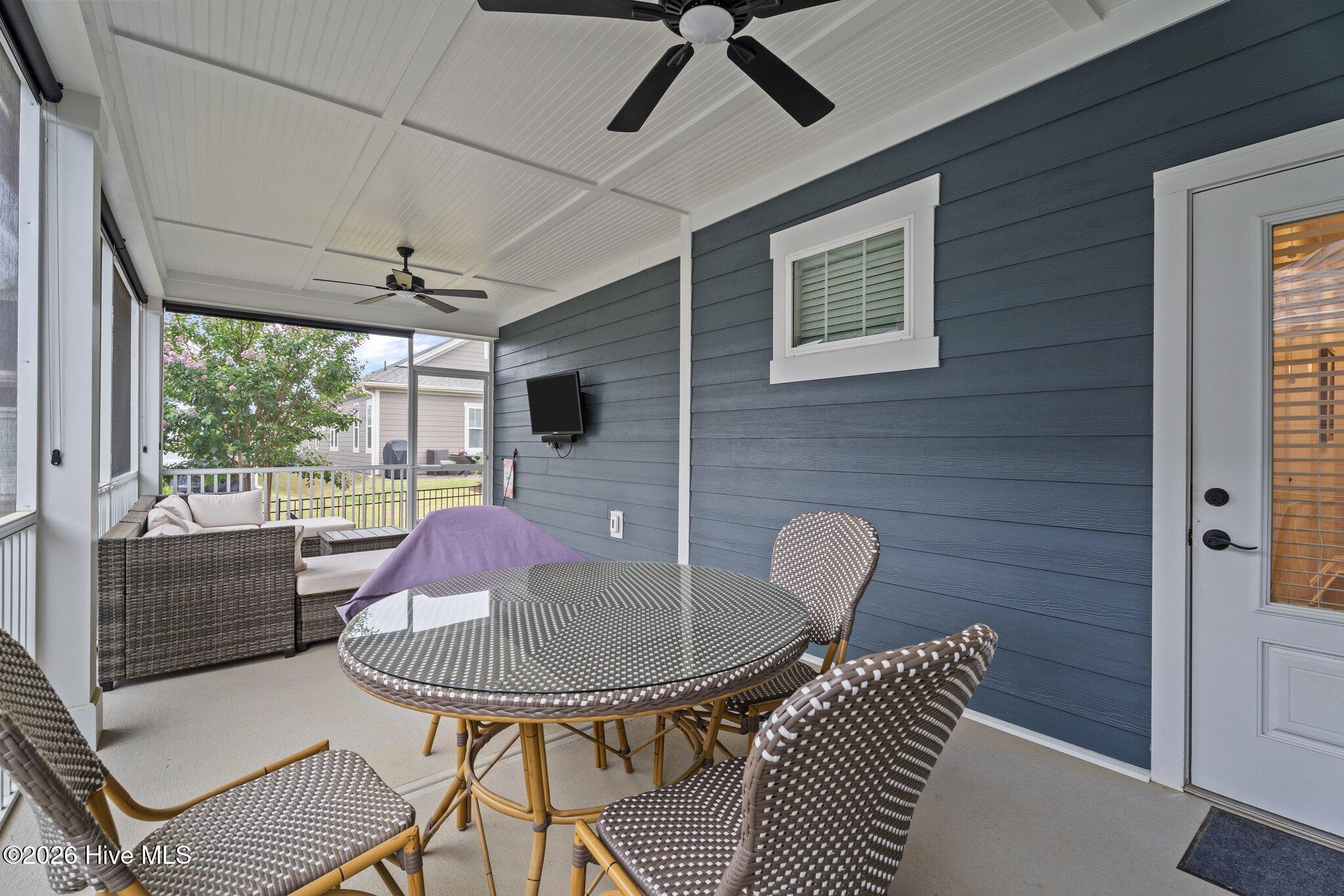 33 Davidson Street Clayton, NC 27520 - Photo 32 of 40 screen-in porch with TV that remains
