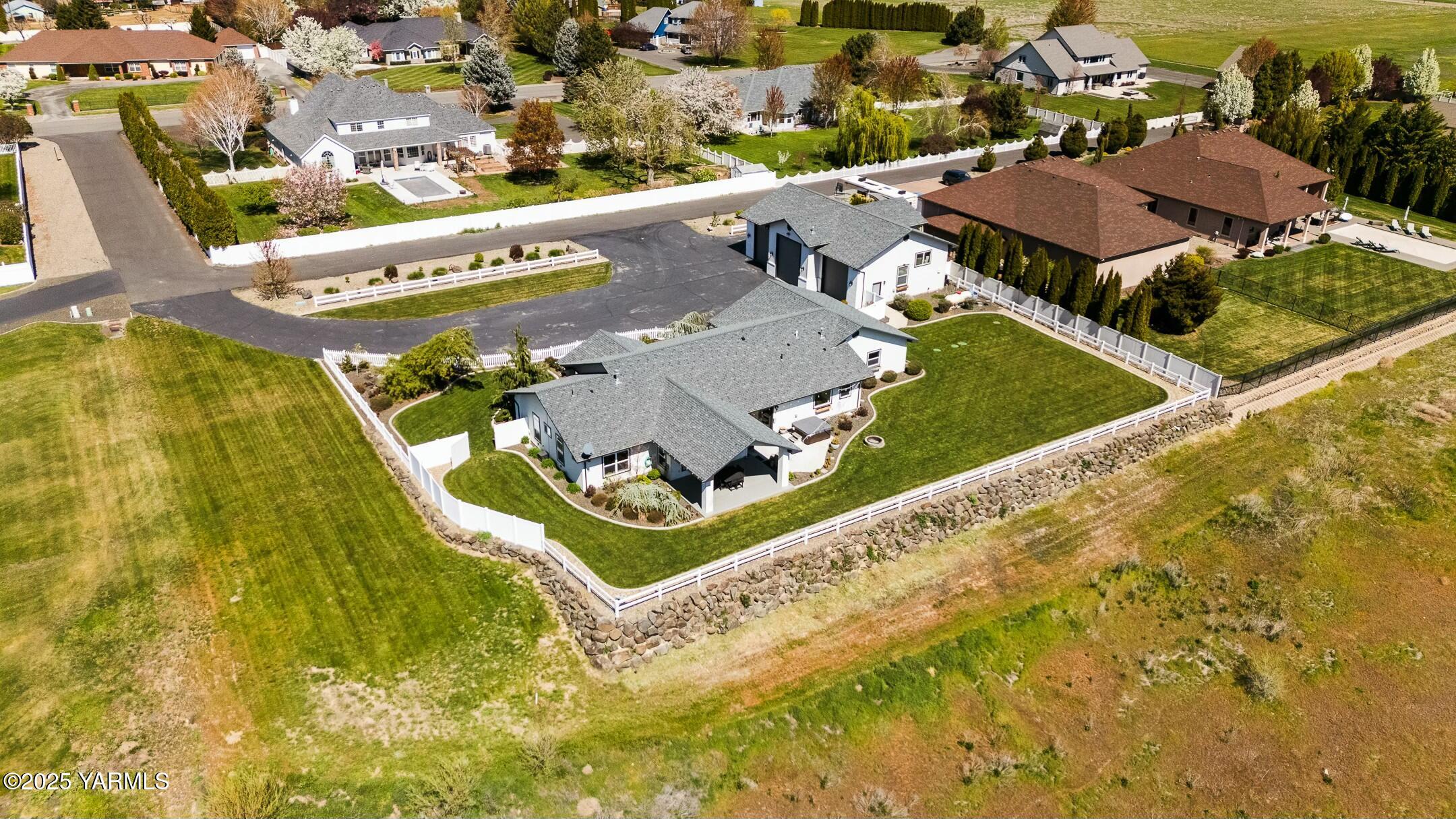 11906 West Barrett Road Yakima, WA 98908 - Photo 50 of 55 an aerial view of a house with swimming pool and ocean view