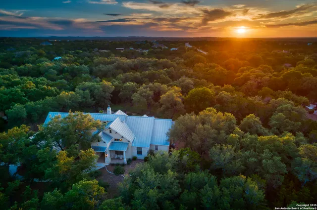 an aerial view of house with yard