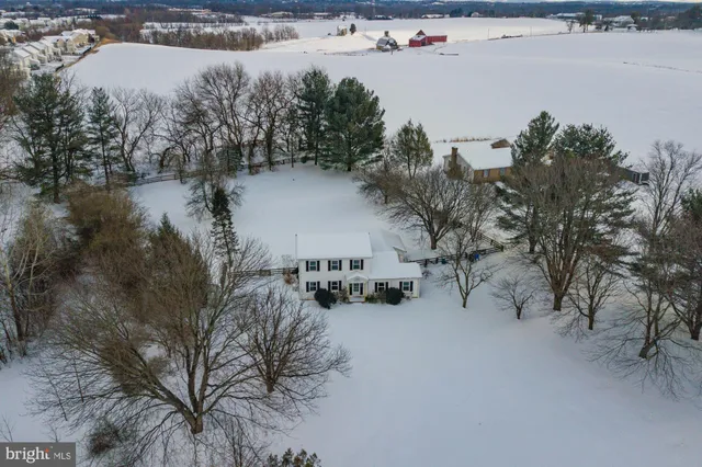 a view of a lake with trees all around