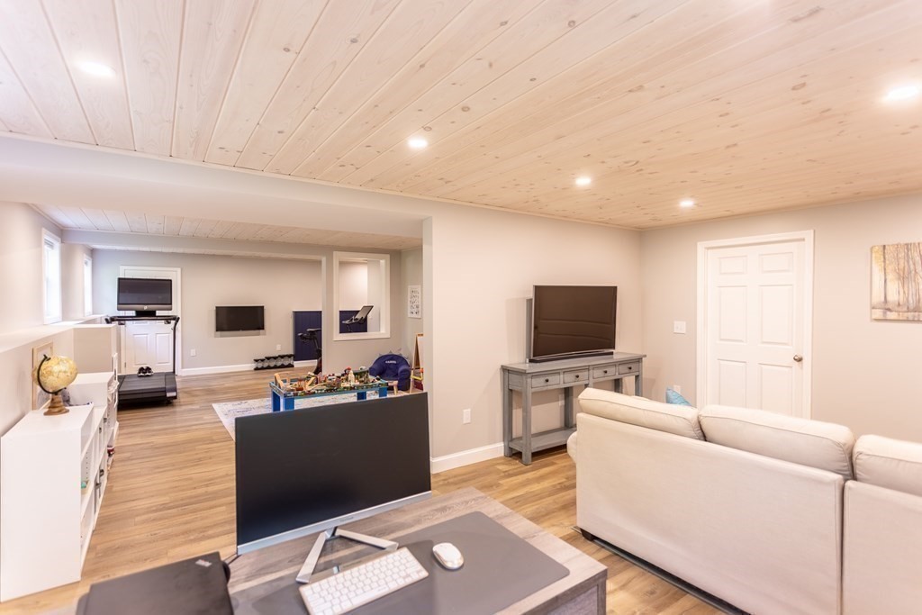 46 True Road Salisbury, MA 01952 - Photo 25 of 25 a living room with furniture and a flat screen tv