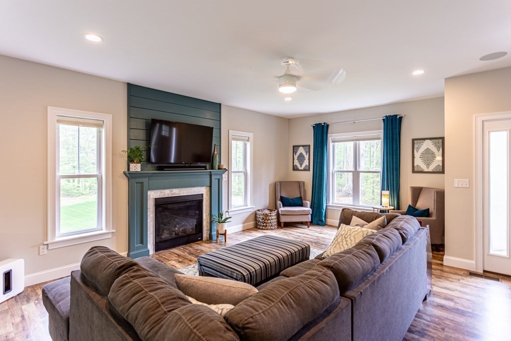 46 True Road Salisbury, MA 01952 - Photo 5 of 25 a living room with furniture window and a fireplace