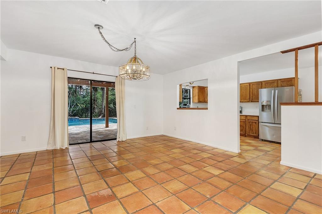 480 9th Street Southwest Naples, FL 34117 - Photo 7 of 11 DINING AREA OVERLOOKS POOL AND LANAI