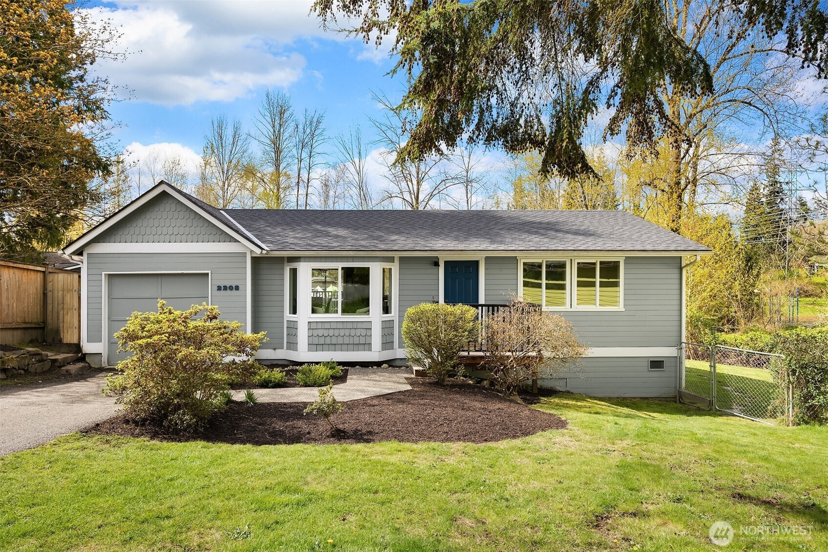 2208 182nd Street Southeast Bothell, WA 98012 - Photo 1 of 24 a front view of a house with a yard and porch