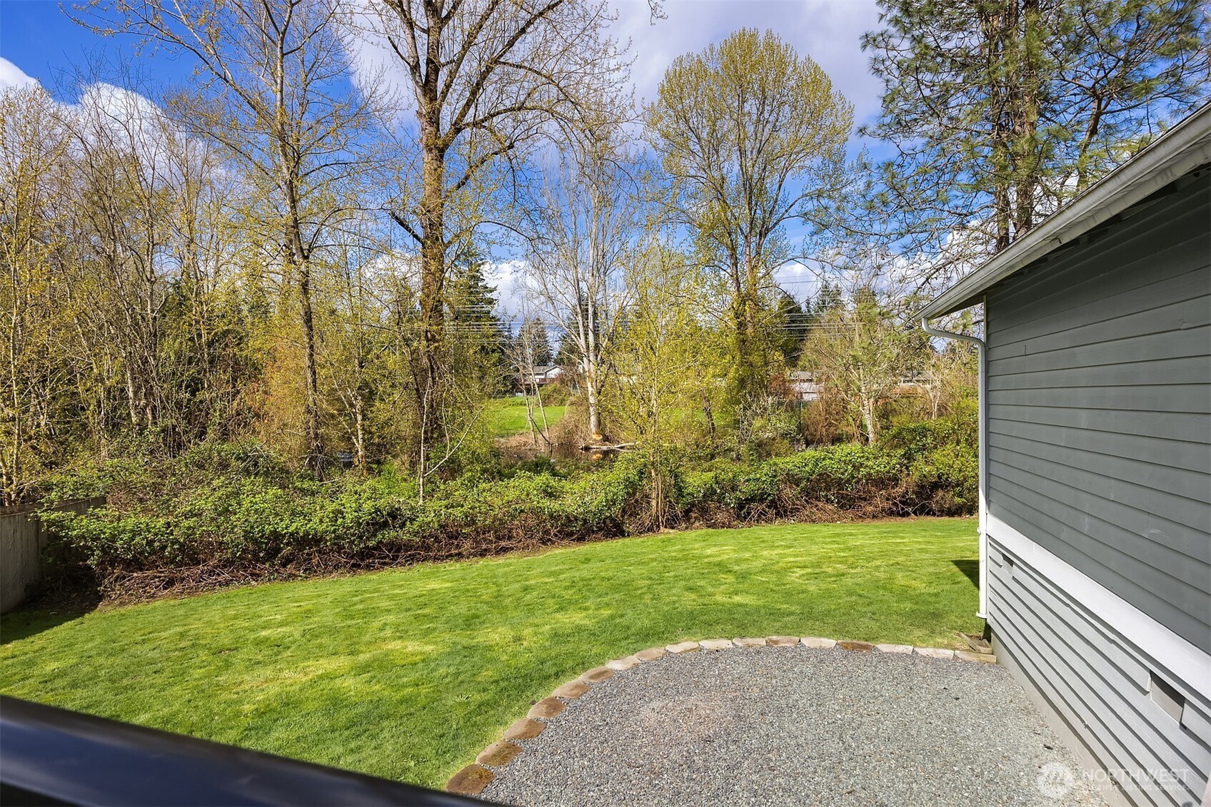 2208 182nd Street Southeast Bothell, WA 98012 - Photo 11 of 24 a view of a backyard with large trees