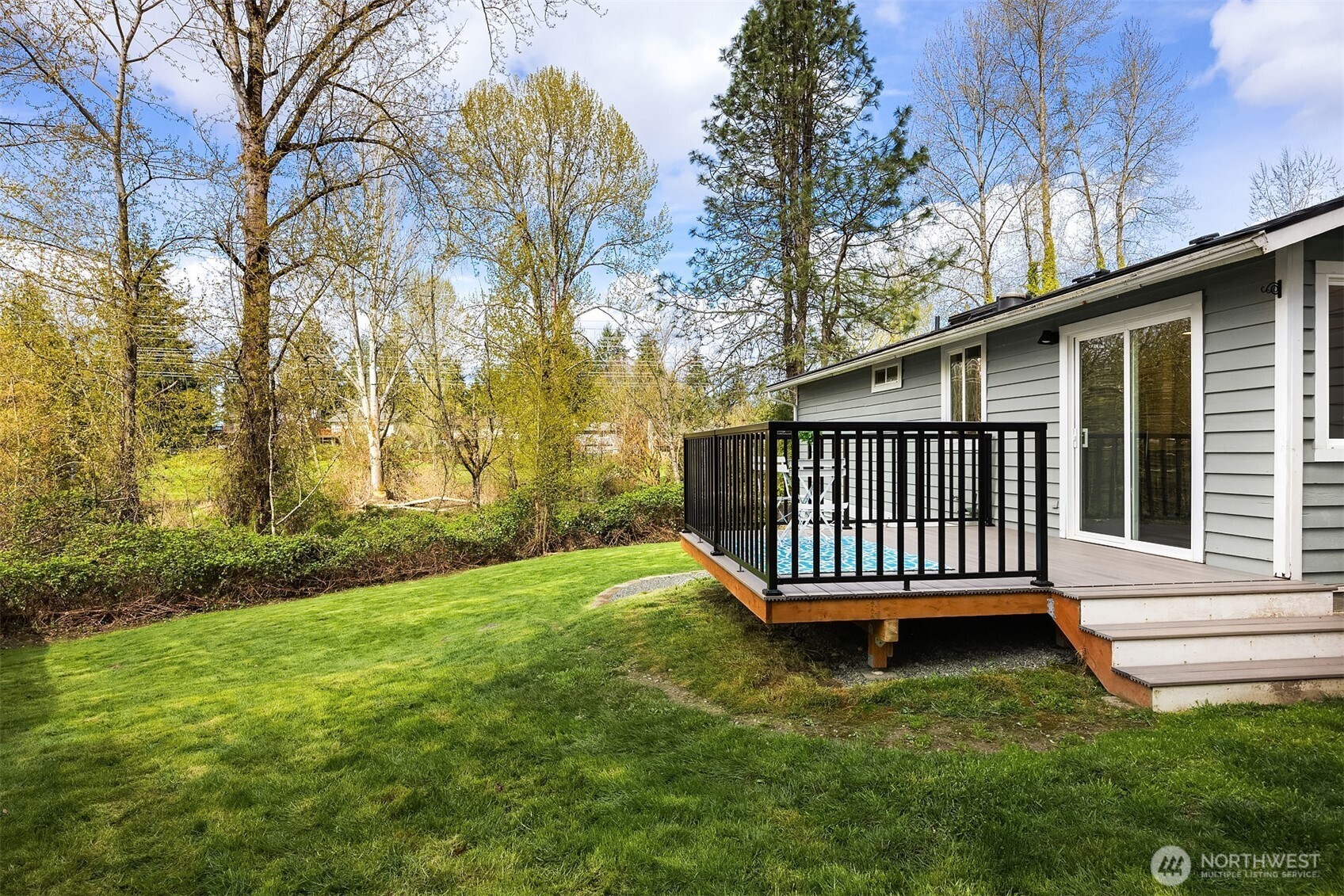 2208 182nd Street Southeast Bothell, WA 98012 - Photo 12 of 24 a view of a yard with a fence and a tree