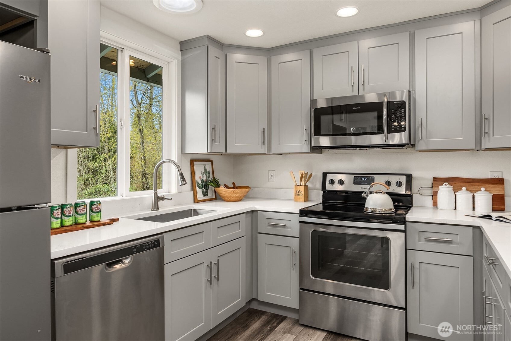 2208 182nd Street Southeast Bothell, WA 98012 - Photo 15 of 24 a kitchen with a sink stove and microwave