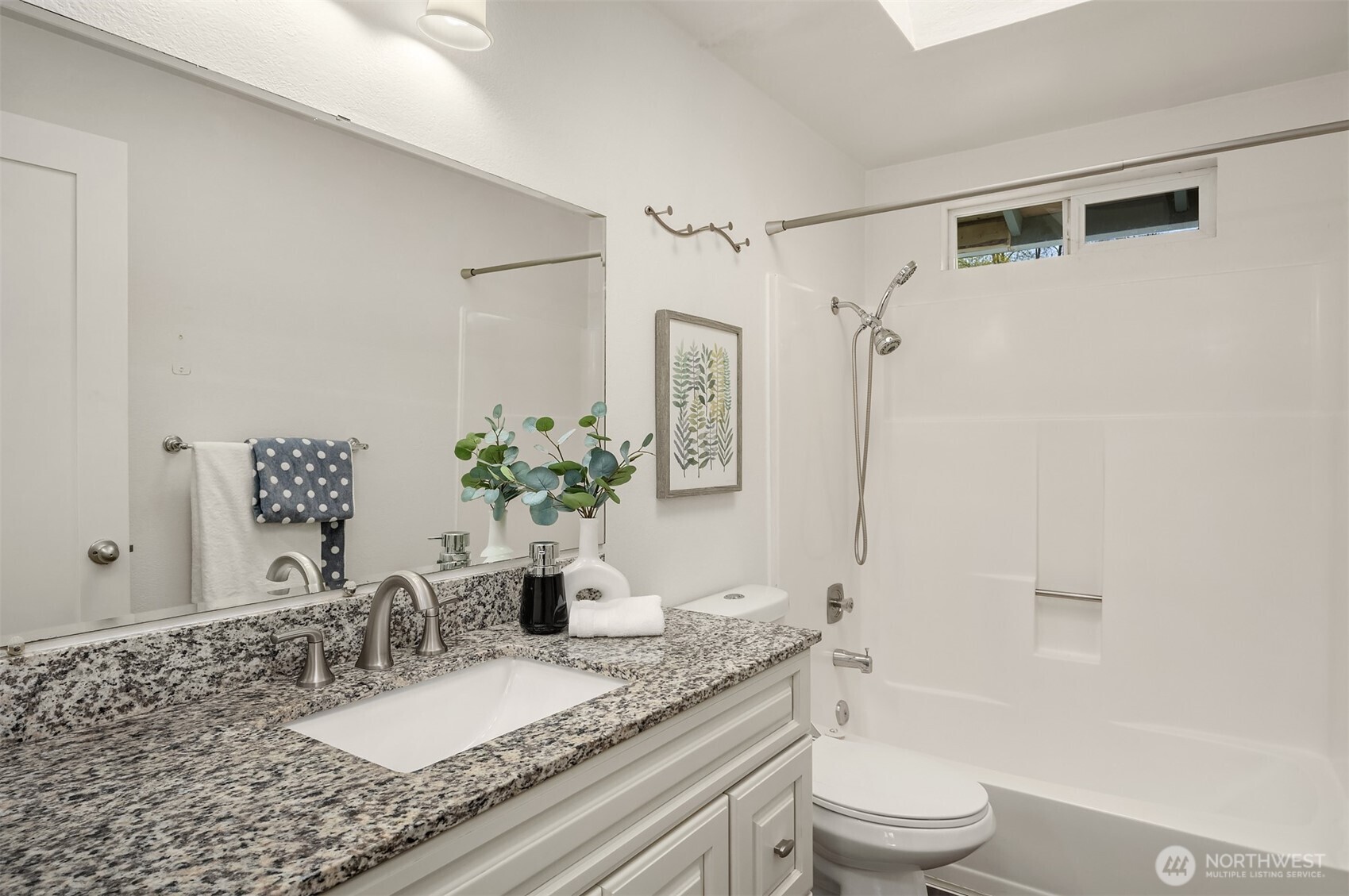 2208 182nd Street Southeast Bothell, WA 98012 - Photo 16 of 24 a bathroom with a granite countertop sink a toilet and shower