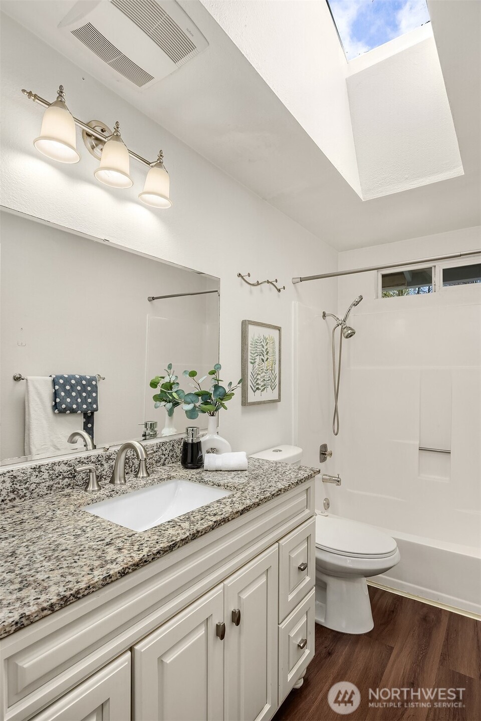 2208 182nd Street Southeast Bothell, WA 98012 - Photo 20 of 24 a bathroom with a granite countertop sink a toilet and shower