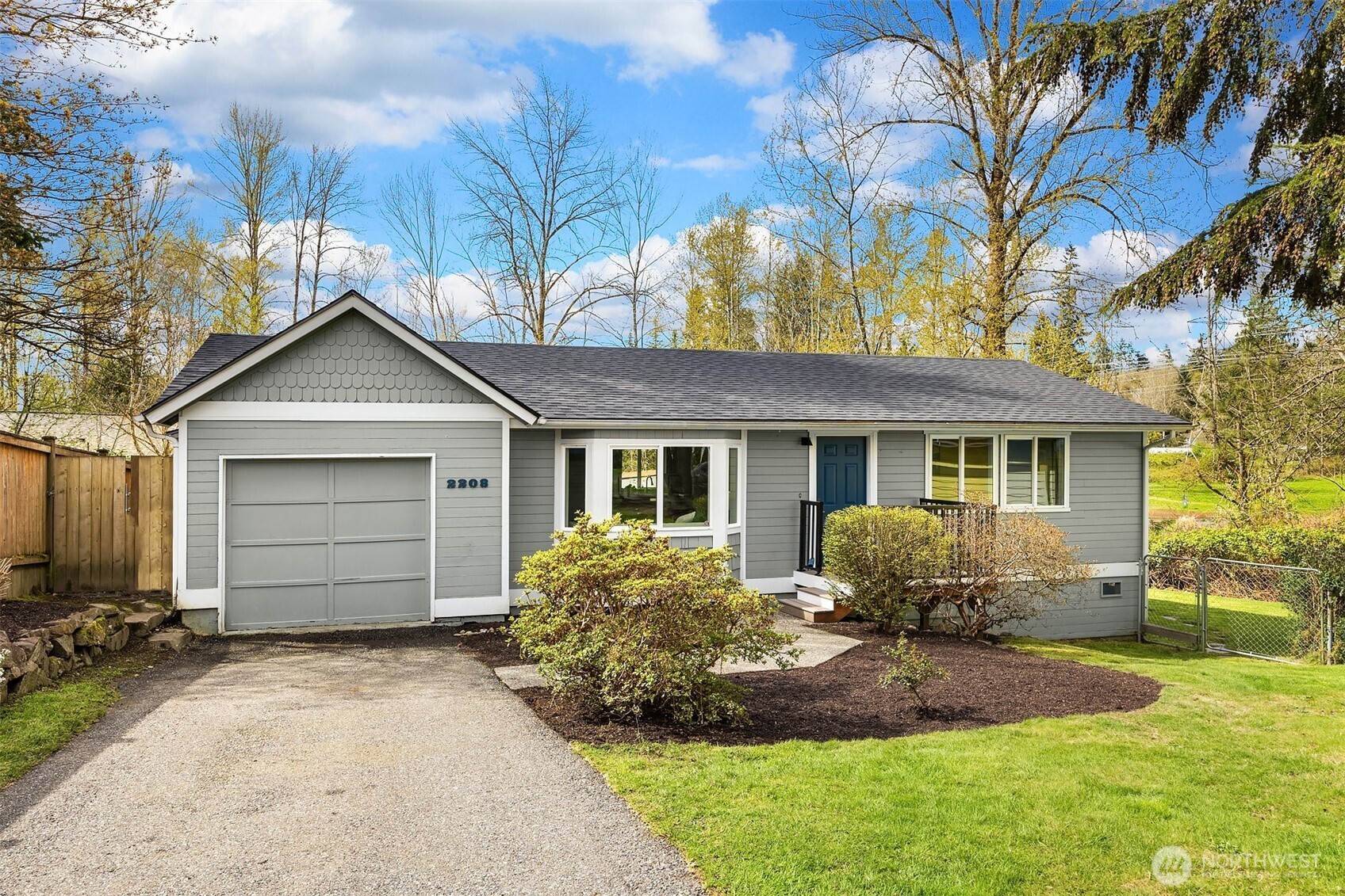 2208 182nd Street Southeast Bothell, WA 98012 - Photo 24 of 24 a front view of a house with a yard and garage