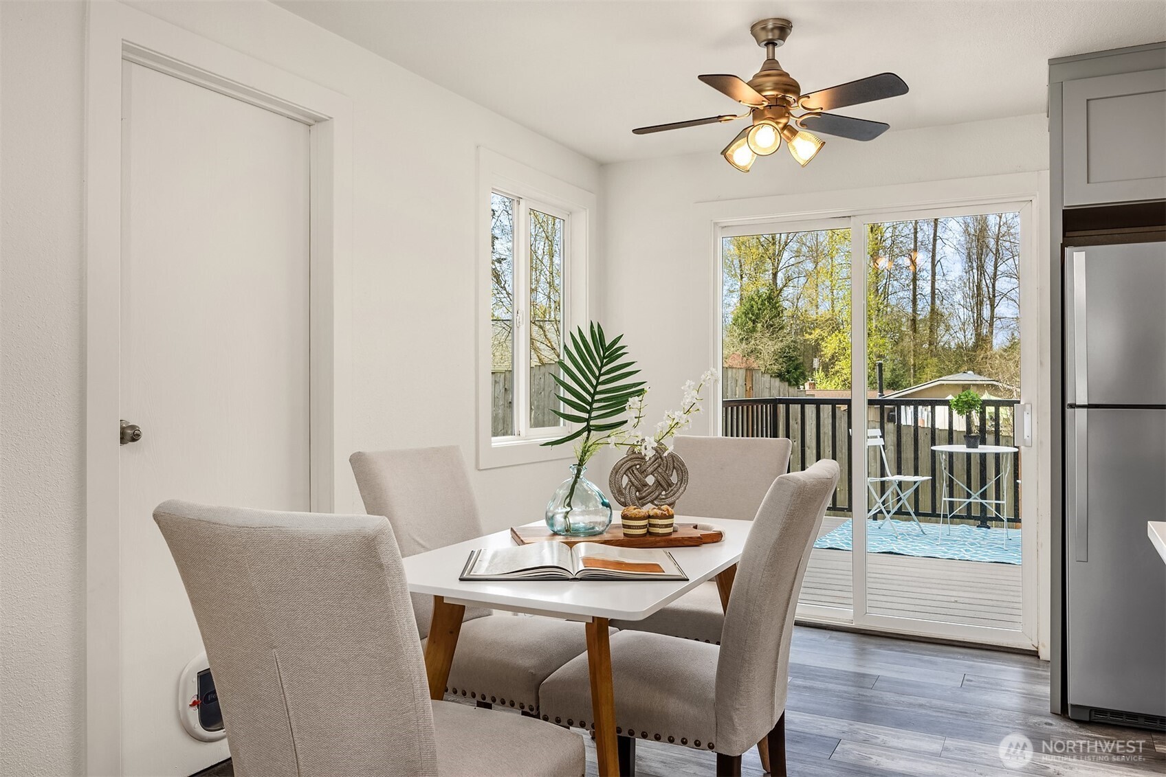 2208 182nd Street Southeast Bothell, WA 98012 - Photo 7 of 24 a dining room with furniture a window and wooden floor