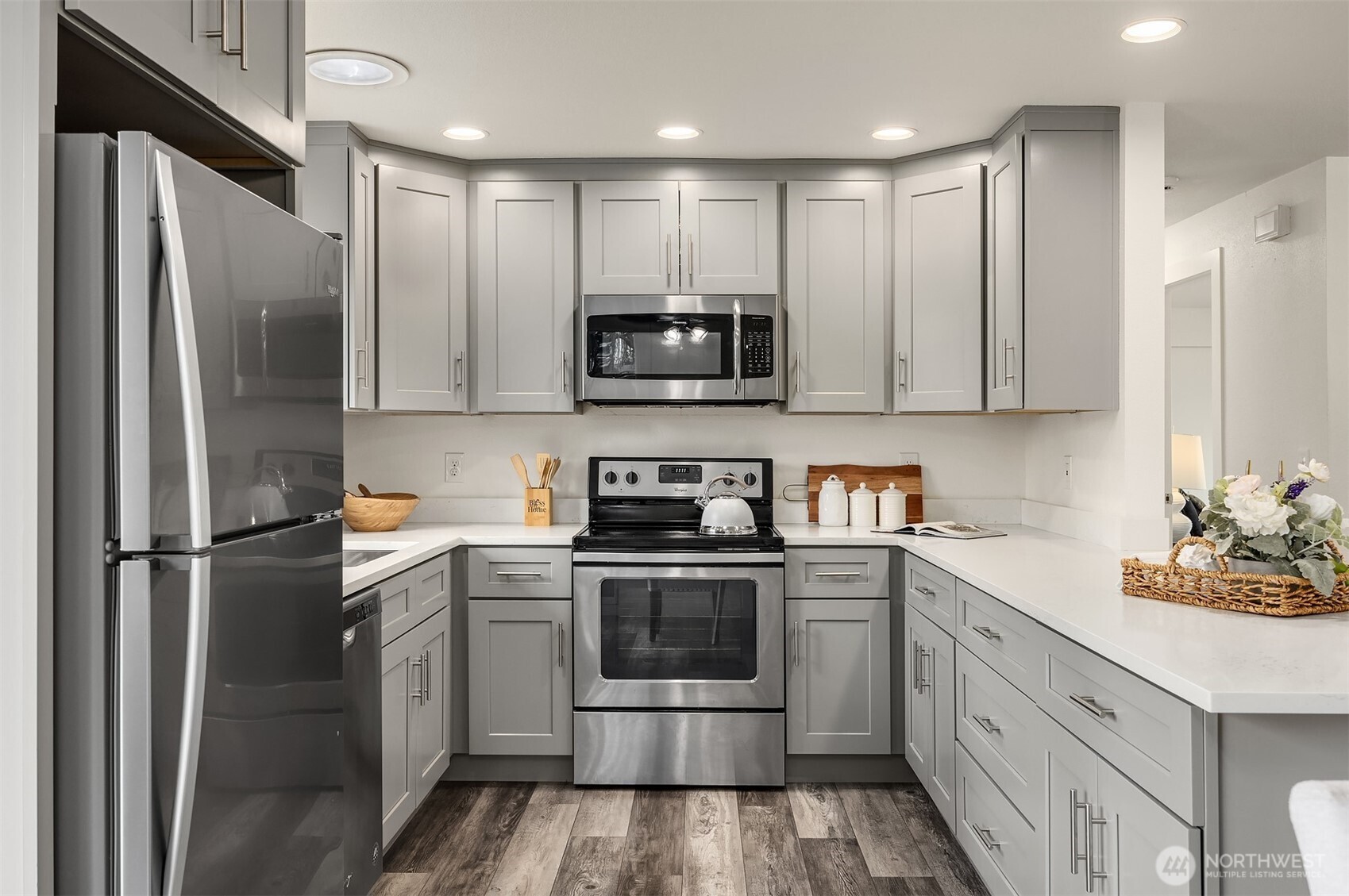 2208 182nd Street Southeast Bothell, WA 98012 - Photo 8 of 24 a kitchen with stainless steel appliances a refrigerator sink and microwave