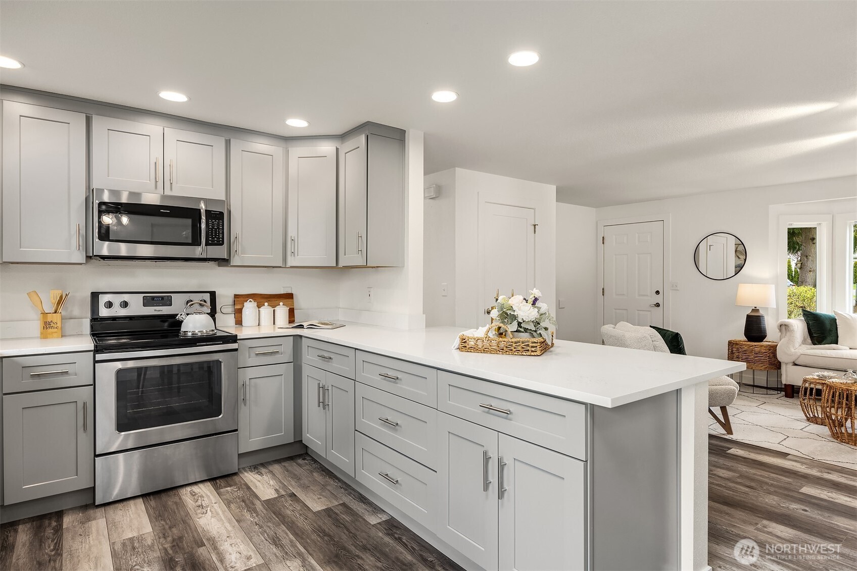 2208 182nd Street Southeast Bothell, WA 98012 - Photo 9 of 24 a kitchen with a sink stove and microwave
