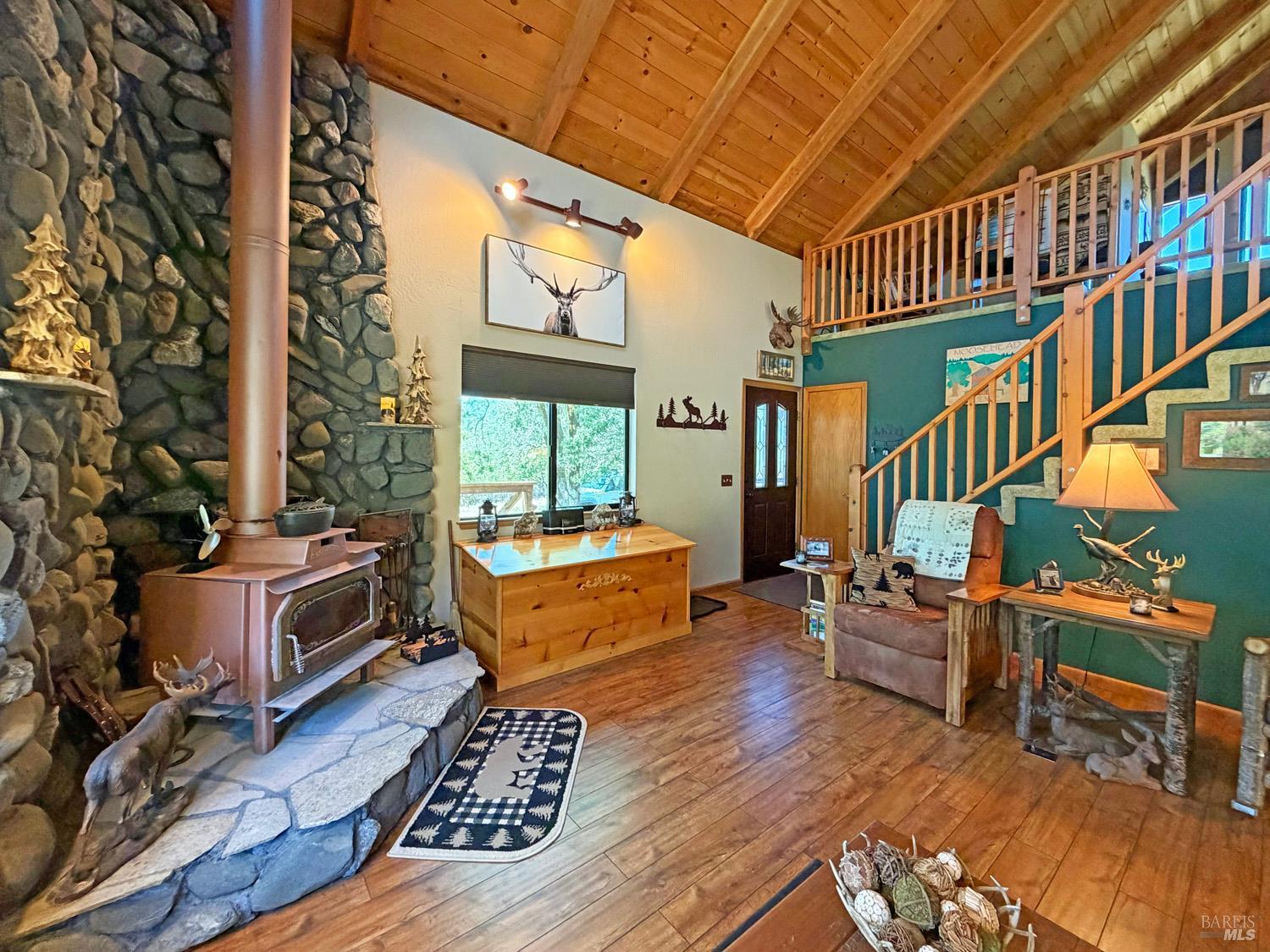 31312 High Point Road Potter Valley, CA 95469 - Photo 10 of 58 a living room with furniture and a wooden floor