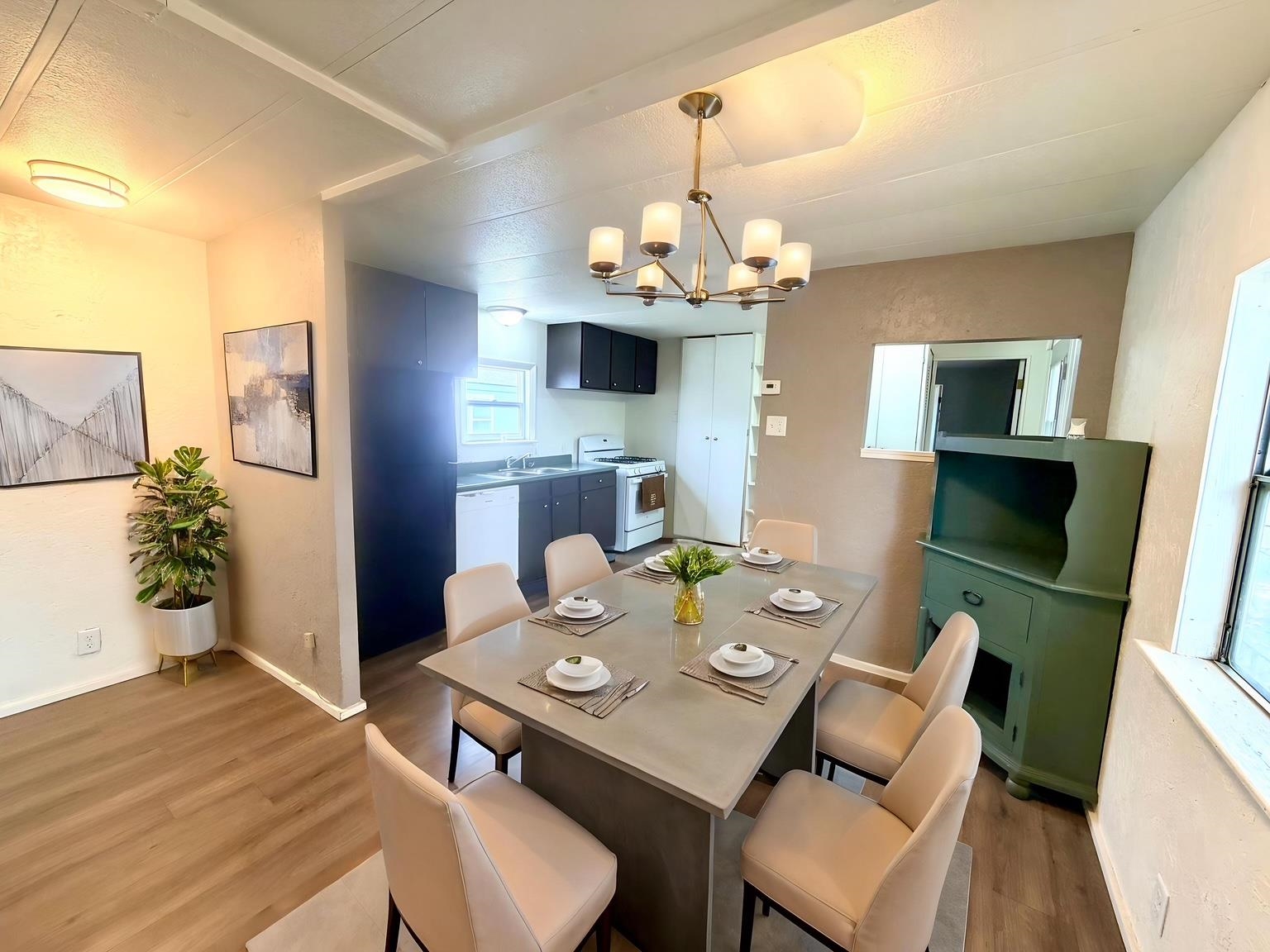 585-25 25 1/2 Road, Unit 237 Grand Junction, CO 81505 - Photo 11 of 31 a view of a dining room with furniture a chandelier and wooden floor