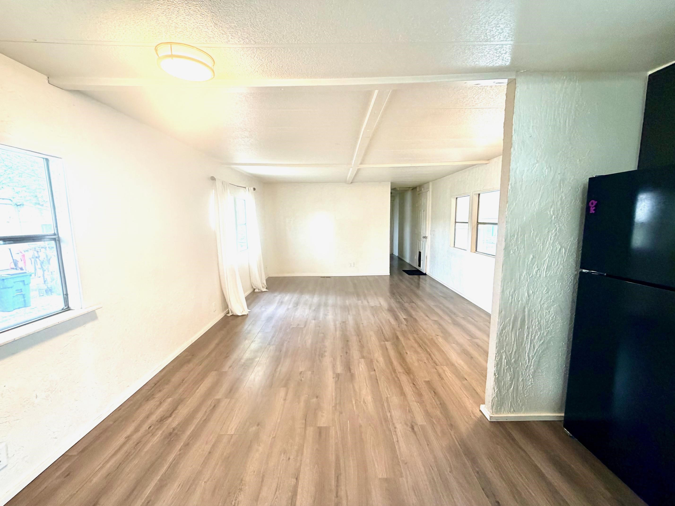 585-25 25 1/2 Road, Unit 237 Grand Junction, CO 81505 - Photo 12 of 31 a view of a room with wooden floor and a window