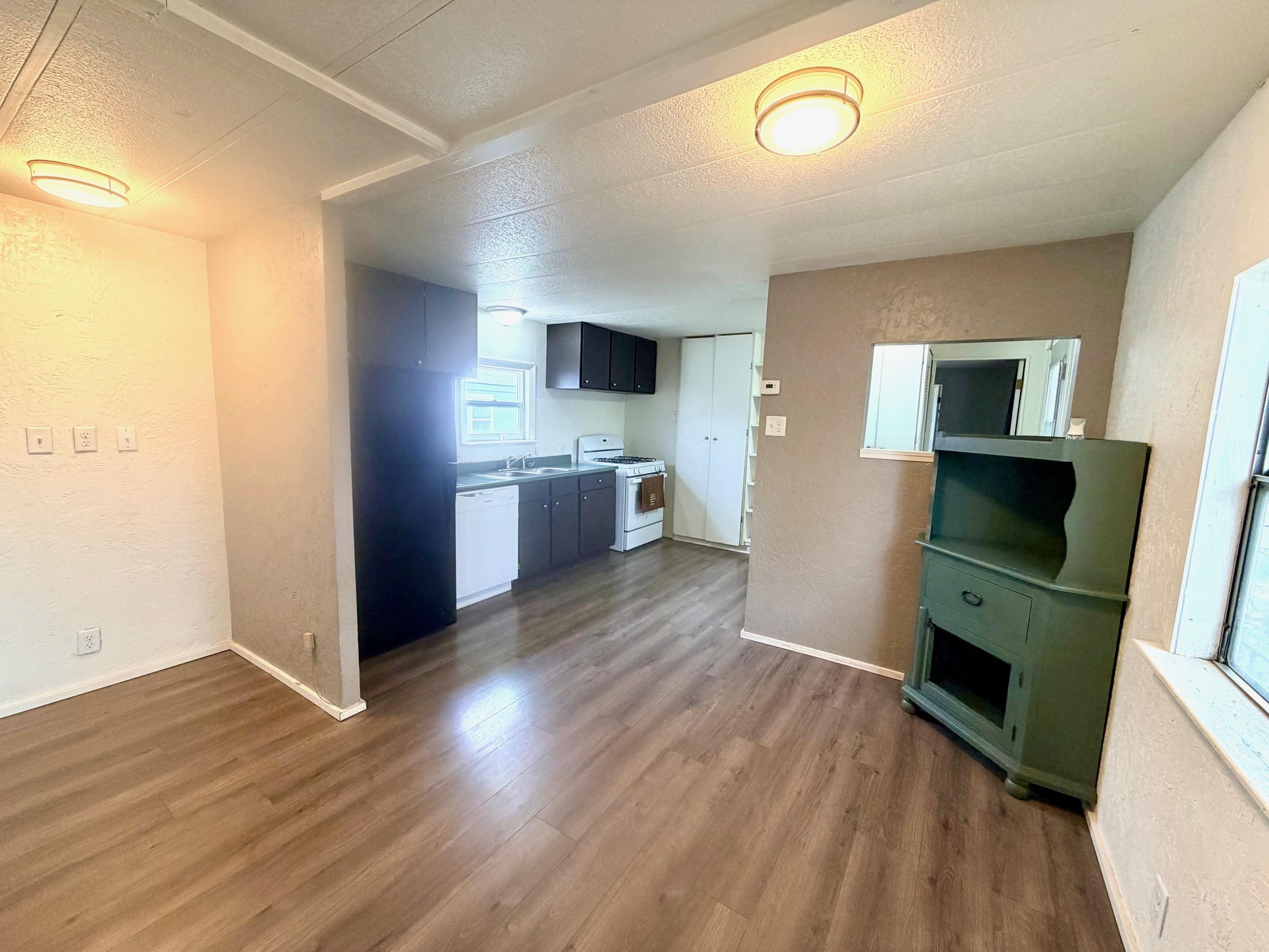 585-25 25 1/2 Road, Unit 237 Grand Junction, CO 81505 - Photo 15 of 31 a kitchen with stainless steel appliances a stove top oven a sink and a refrigerator