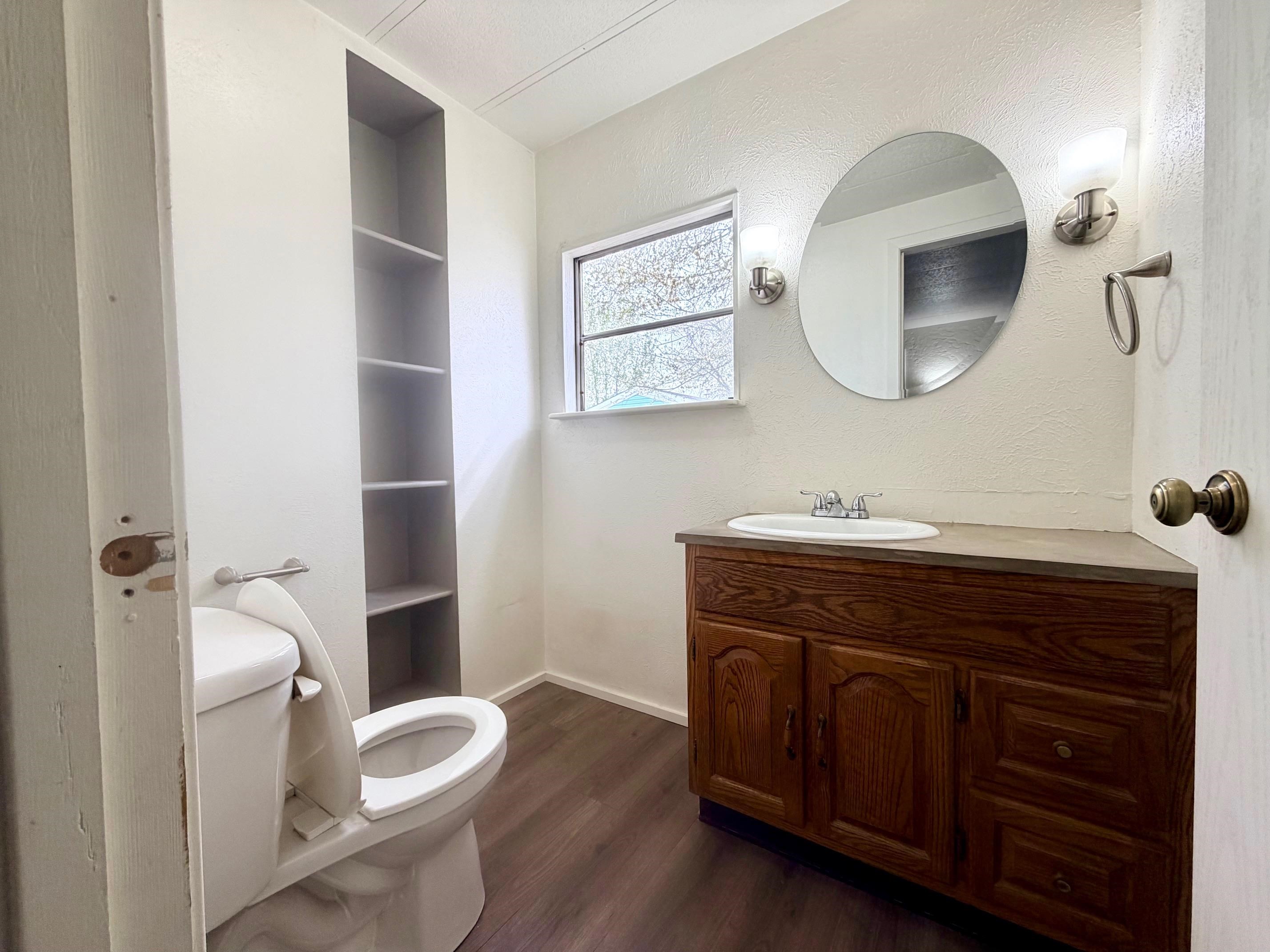 585-25 25 1/2 Road, Unit 237 Grand Junction, CO 81505 - Photo 19 of 31 a spacious bathroom with a toilet a sink and a mirror
