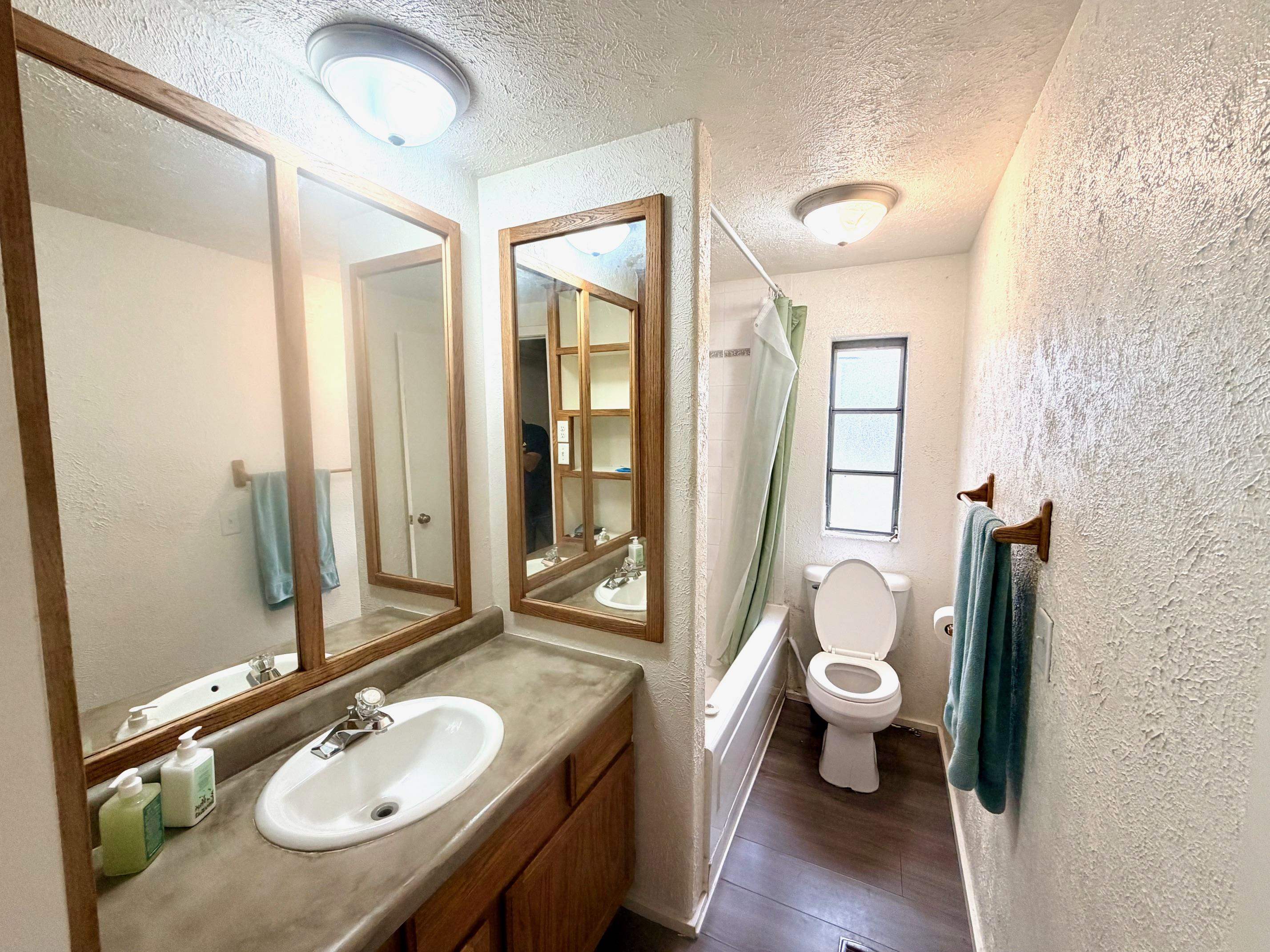 585-25 25 1/2 Road, Unit 237 Grand Junction, CO 81505 - Photo 25 of 31 a bathroom with a granite countertop sink toilet and shower