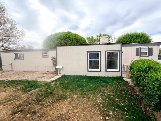 585-25 25 1/2 Road, Unit 237 Grand Junction, CO 81505 - Photo 28 of 31 a view of a backyard with plants and a tree