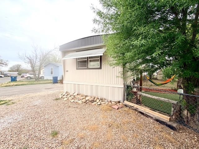 585-25 25 1/2 Road, Unit 237 Grand Junction, CO 81505 - Photo 3 of 31 a backyard of a house with lots of green space