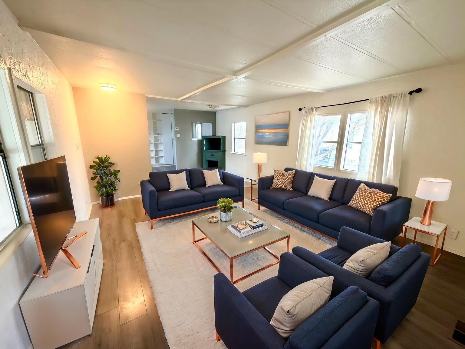 585-25 25 1/2 Road, Unit 237 Grand Junction, CO 81505 - Photo 8 of 31 a living room with furniture and a large window