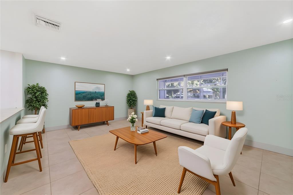 449 Citadel Drive Altamonte Springs, FL 32714 - Photo 2 of 25 a living room with furniture and a potted plant