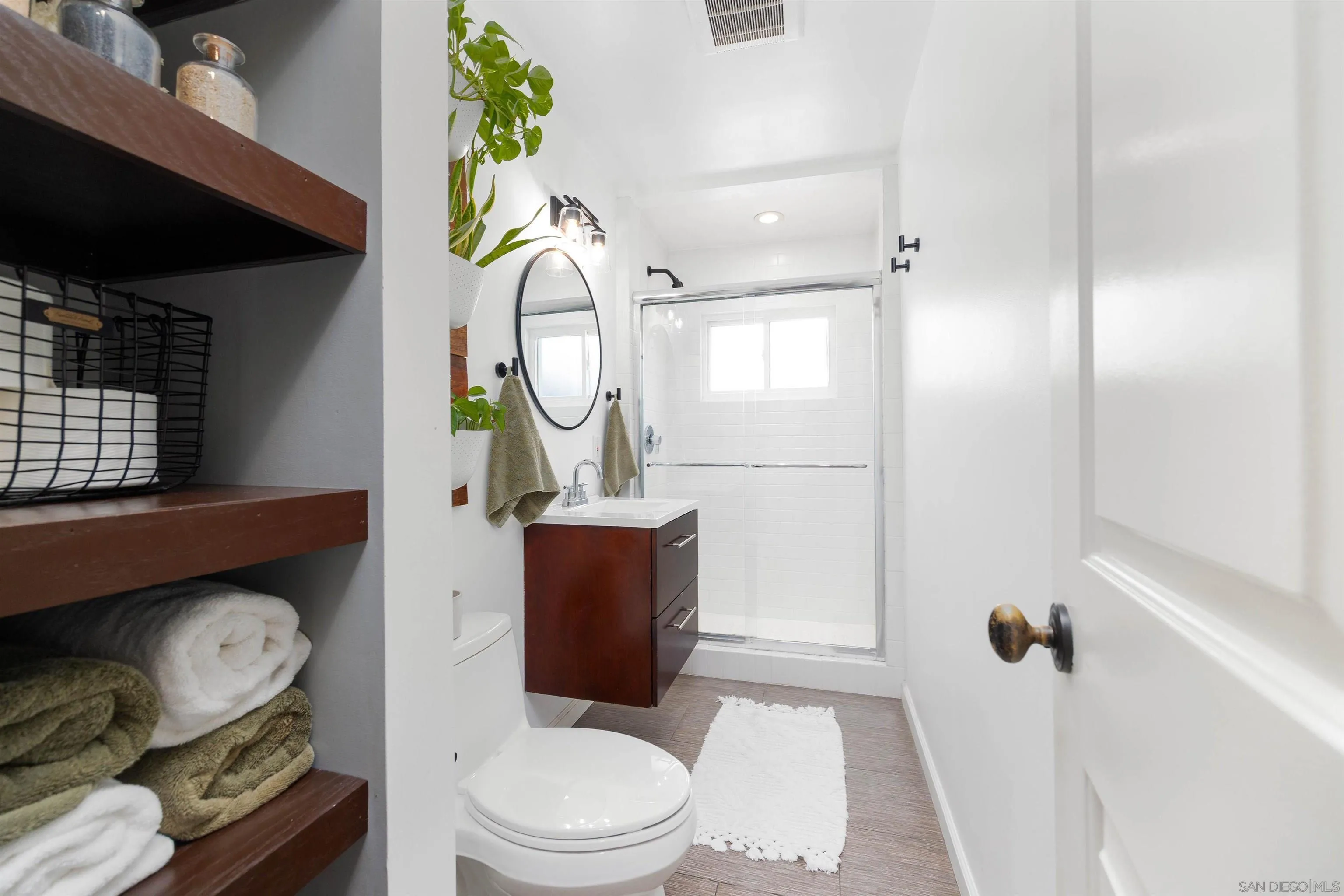 5775 Derk Drive La Mesa, CA 91942 - Photo 11 of 21 a bathroom with a toilet a sink and mirror