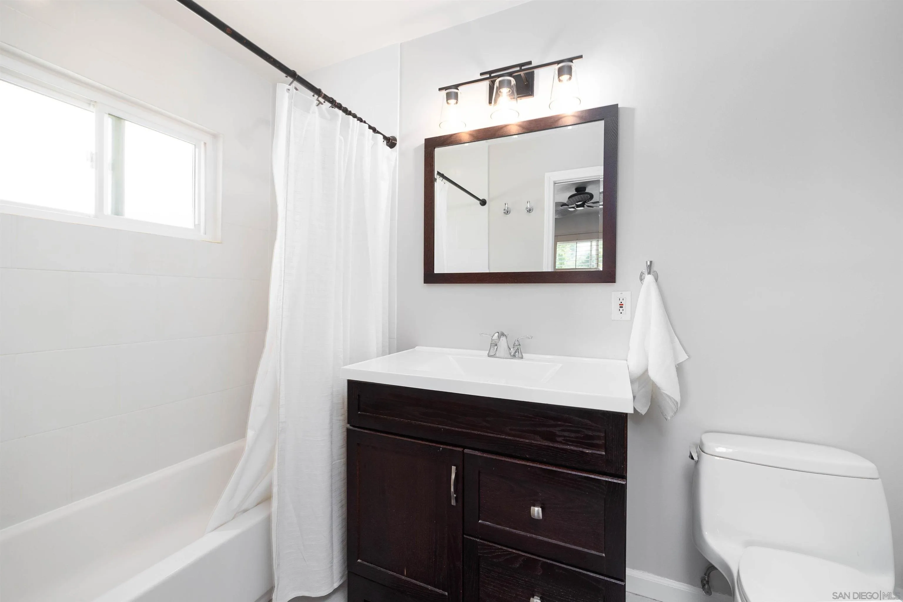 5775 Derk Drive La Mesa, CA 91942 - Photo 14 of 21 a bathroom with a sink a toilet and vanity