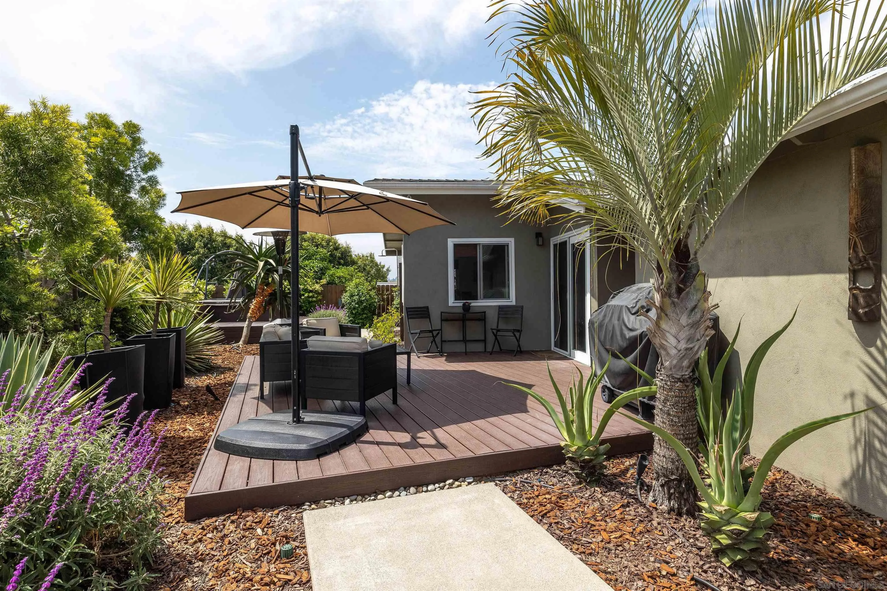 5775 Derk Drive La Mesa, CA 91942 - Photo 21 of 21 a view of a patio with table and chairs potted plants