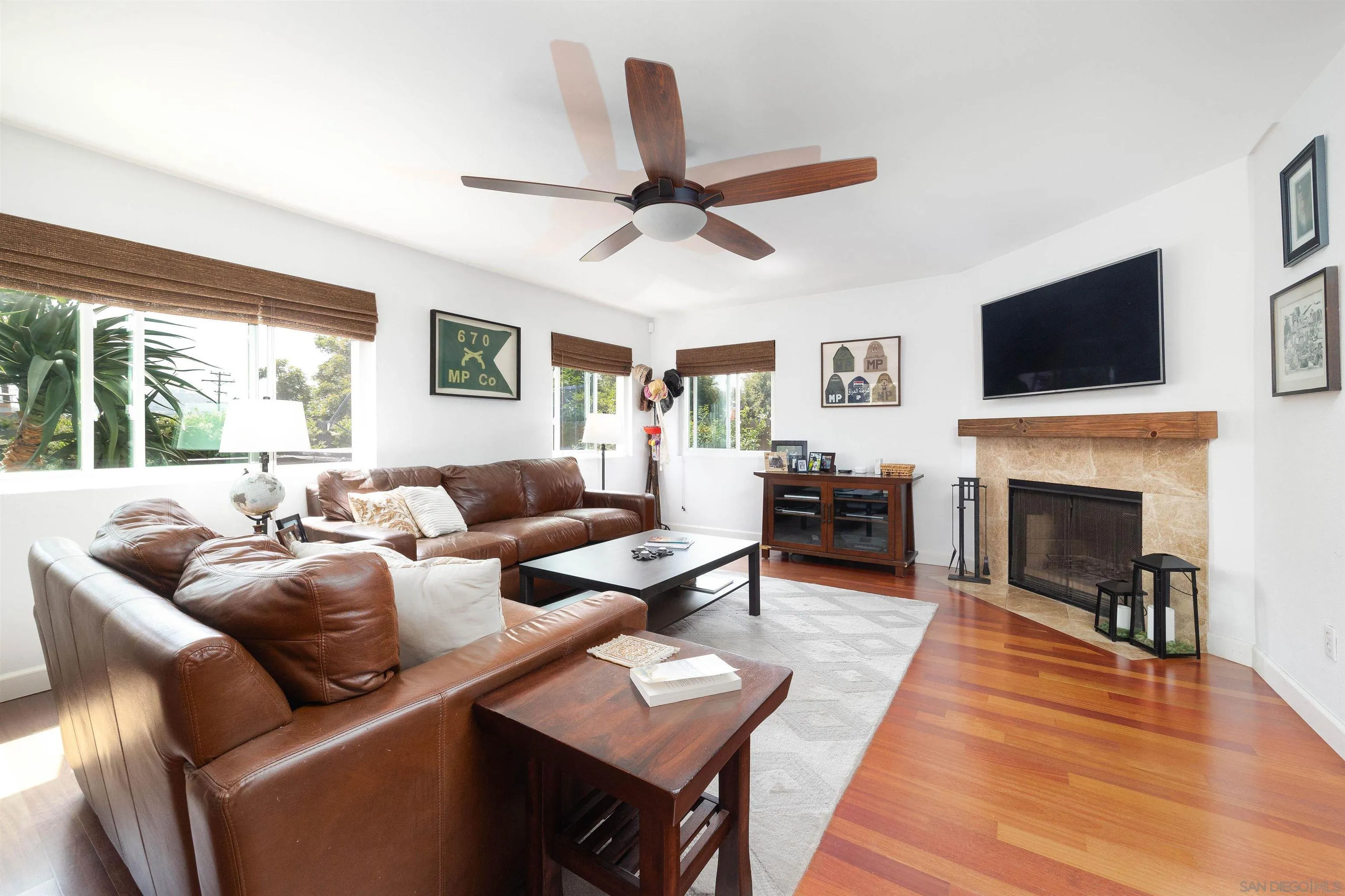 5775 Derk Drive La Mesa, CA 91942 - Photo 6 of 21 a living room with furniture a fireplace and a flat screen tv