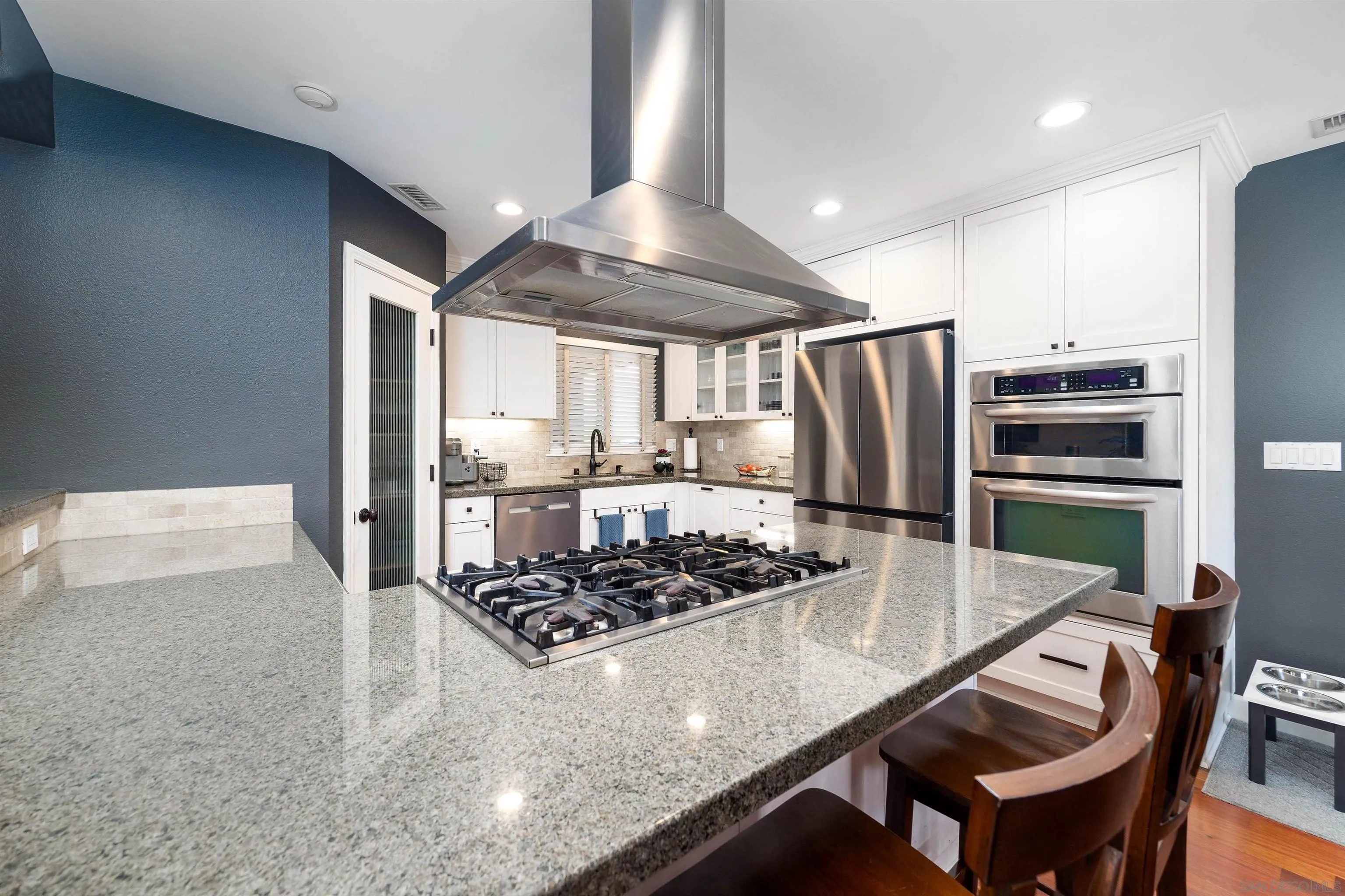 5775 Derk Drive La Mesa, CA 91942 - Photo 9 of 21 a kitchen with stainless steel appliances granite countertop a stove a refrigerator and a refrigerator