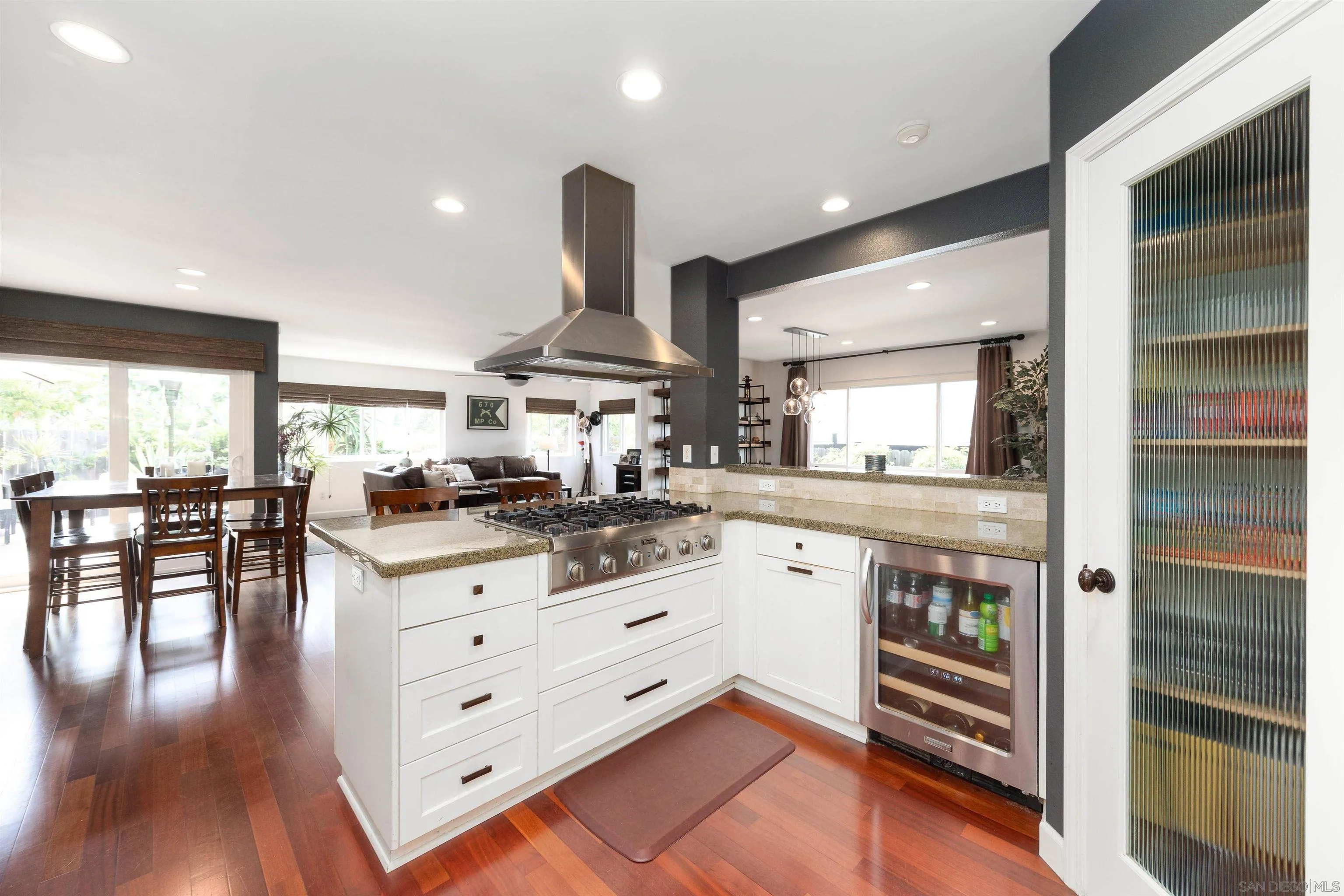 5775 Derk Drive La Mesa, CA 91942 - Photo 10 of 21 a kitchen with stainless steel appliances kitchen island granite countertop a stove a sink and a refrigerator