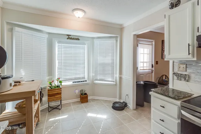 a kitchen that has a sink and a stove in it