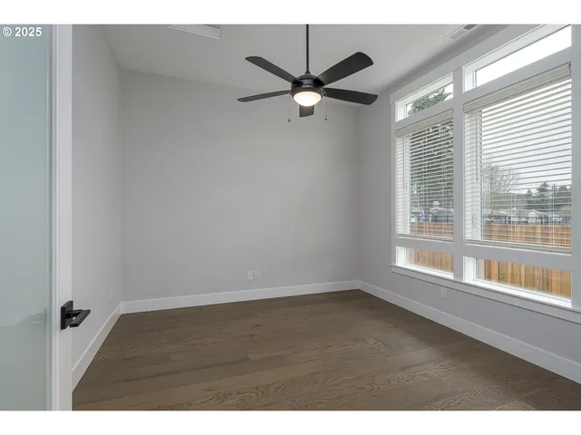 a view of an empty room and a window
