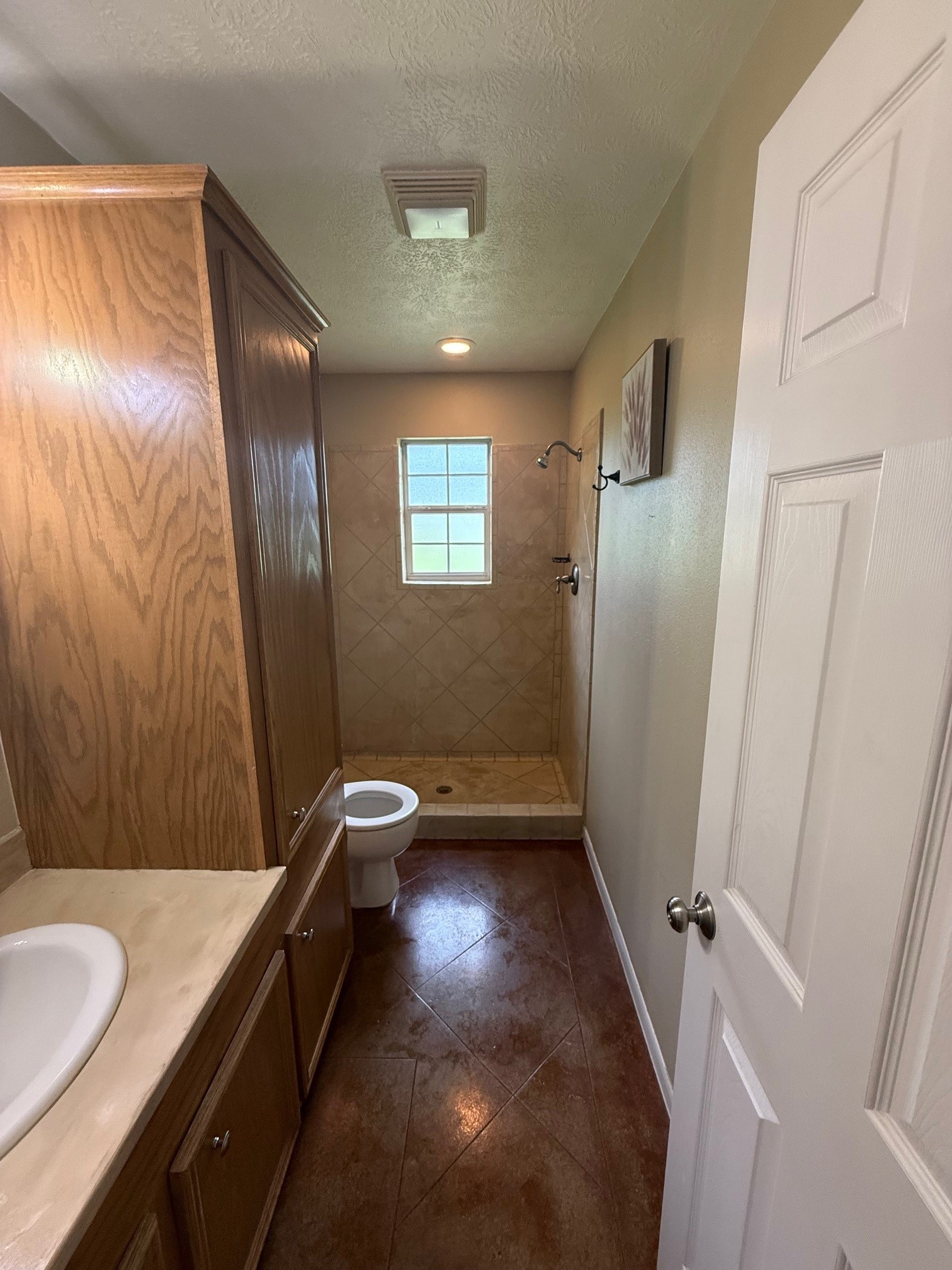 2376 Highway 61 Devers, TX 77538 - Photo 14 of 17 a bathroom with a sink a toilet and shower