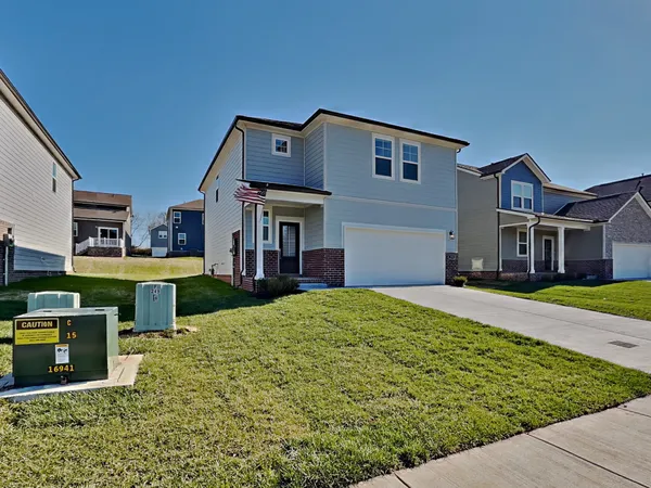 a front view of a house with a yard