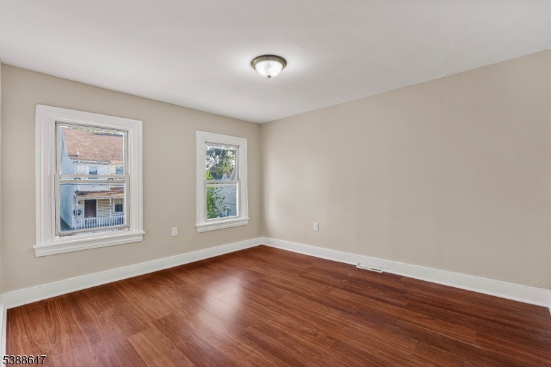 330 Chambers Street Phillipsburg, NJ 08865 - Photo 18 of 27 a view of empty room with wooden floor and fan