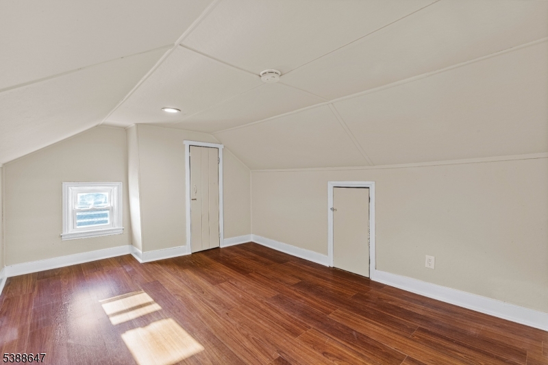 330 Chambers Street Phillipsburg, NJ 08865 - Photo 20 of 27 an empty room with wooden floor and windows
